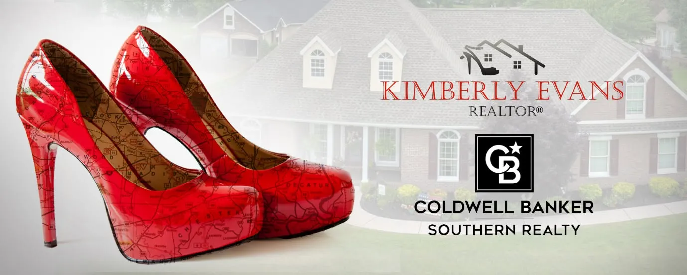 Red patent stilettos printed with the West Tennessee road map, in front of a brick home, with the Kimberly Evans and Coldwell Banker Southern Realty logos